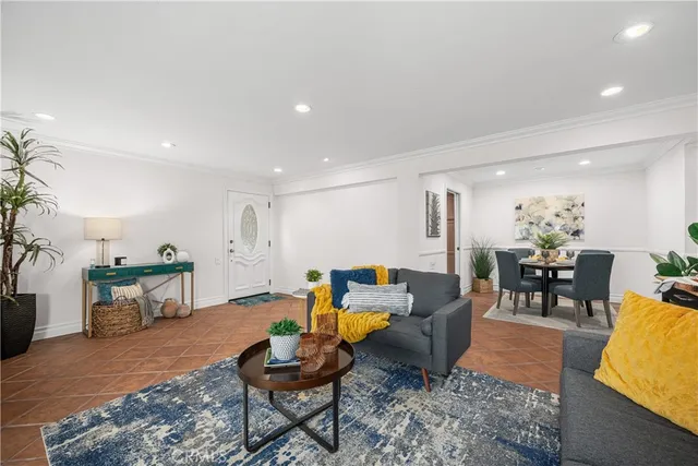 a living room with furniture and windows