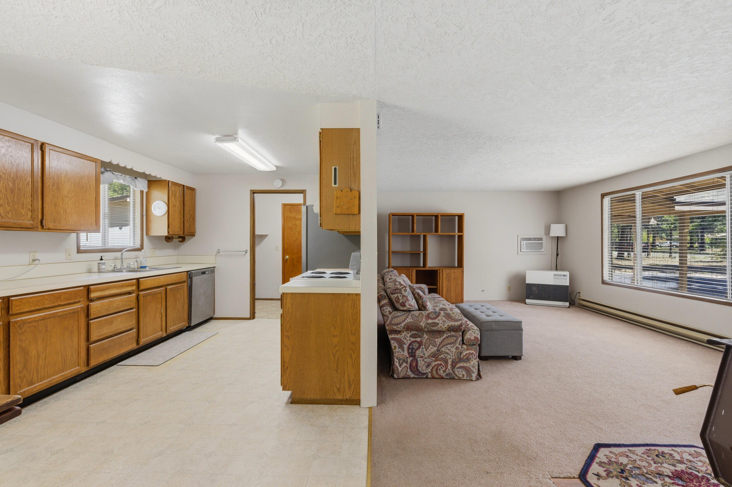 50868 Doe Loop La Pine, OR 97739 - Photo 11 of 51 a spacious bedroom with a bed couch and window
