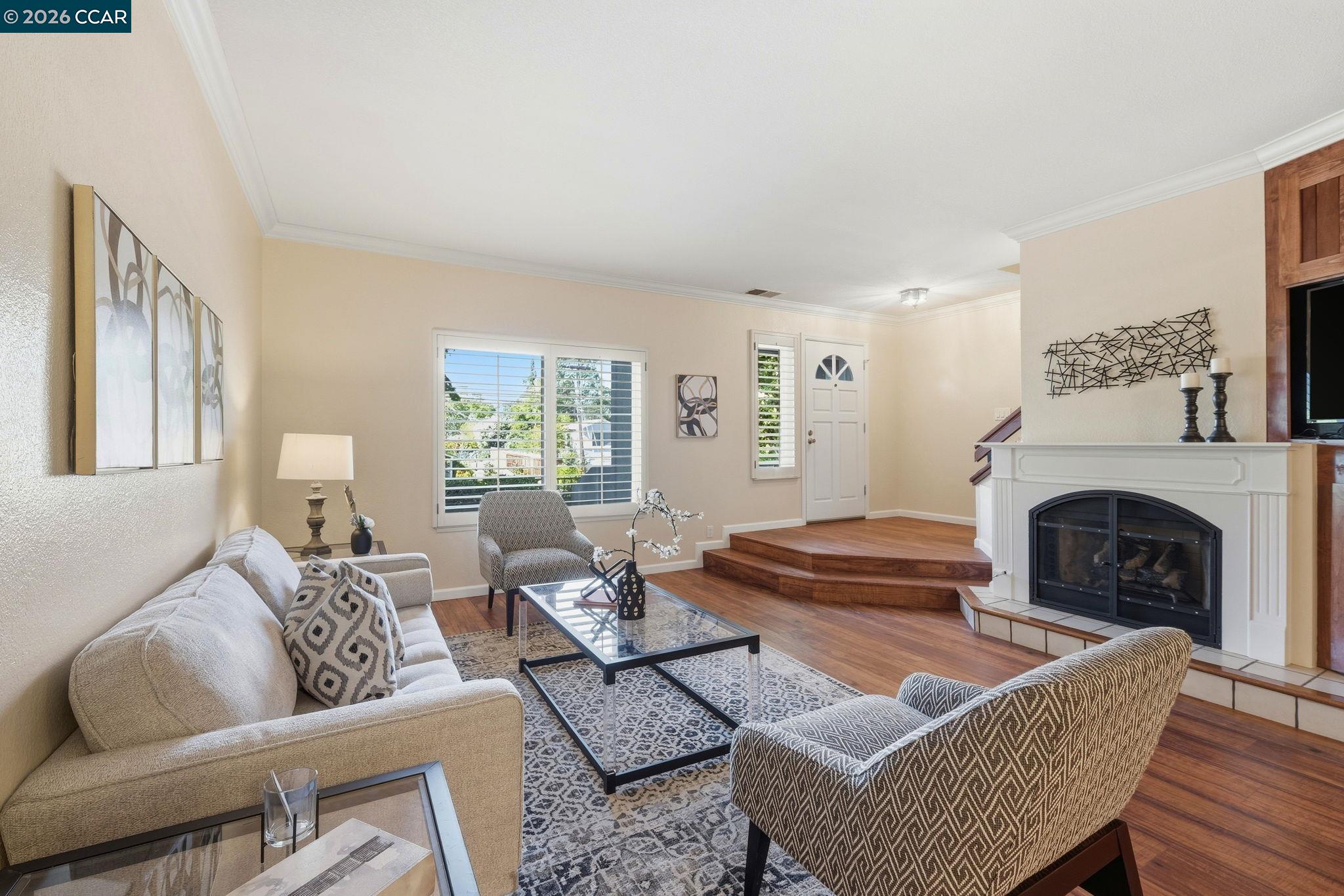 1707 Geary Road Walnut Creek, CA 94597 - Photo 8 of 43 a living room with furniture a fireplace and a window