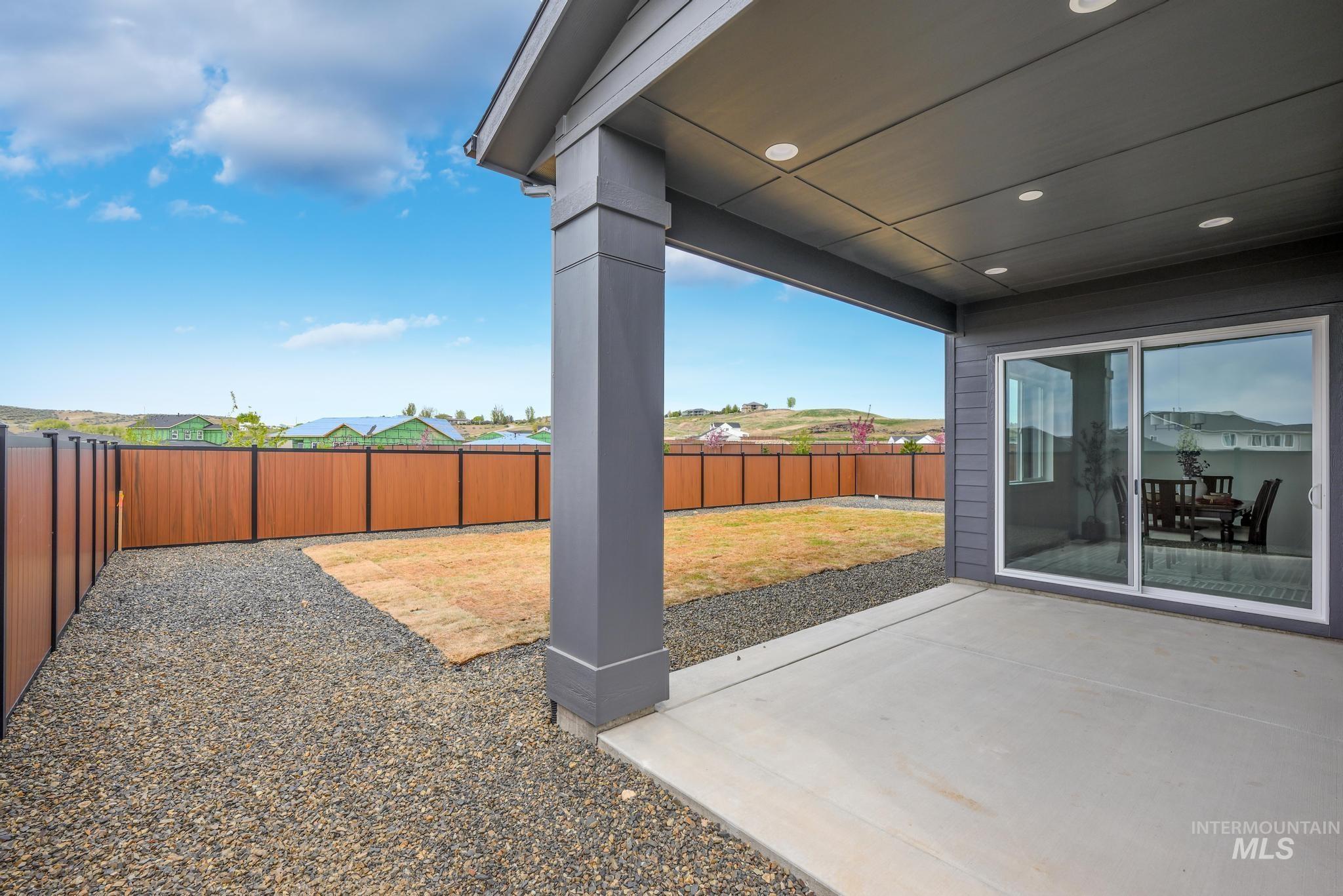 9767 West Nicasio Drive Star, ID 83669 - Photo 12 of 12 Fenced backyard with a patio