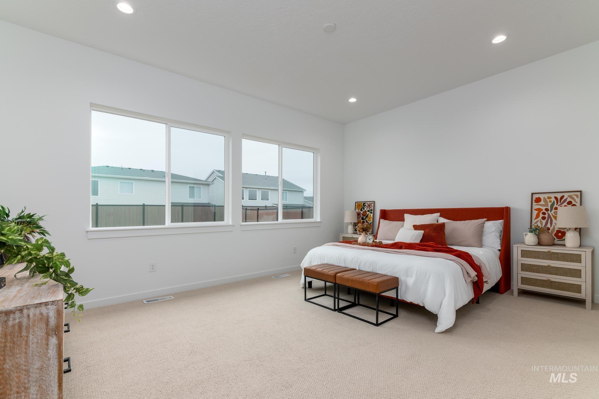 9767 West Nicasio Drive Star, ID 83669 - Photo 8 of 12 Bedroom with carpet flooring and recessed lighting