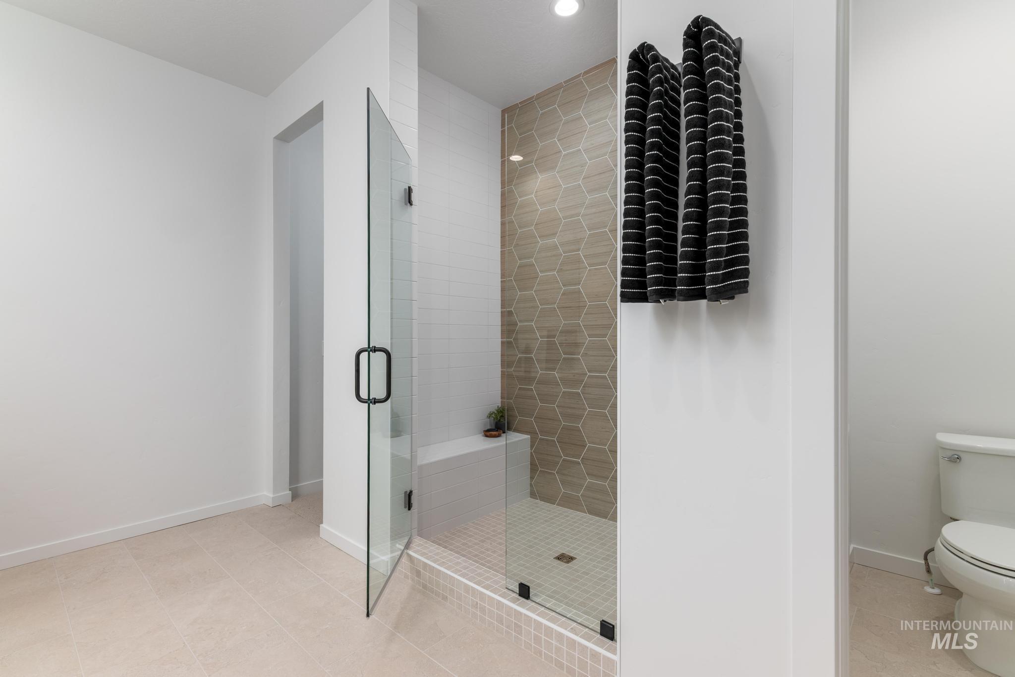 9767 West Nicasio Drive Star, ID 83669 - Photo 10 of 12 Bathroom featuring a stall shower and light tile patterned floors