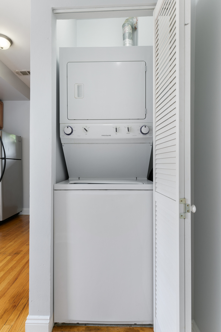 2005 West Jarvis Avenue, Unit 1 Chicago, IL 60645 - Photo 9 of 18 a utility room with dryer and washer