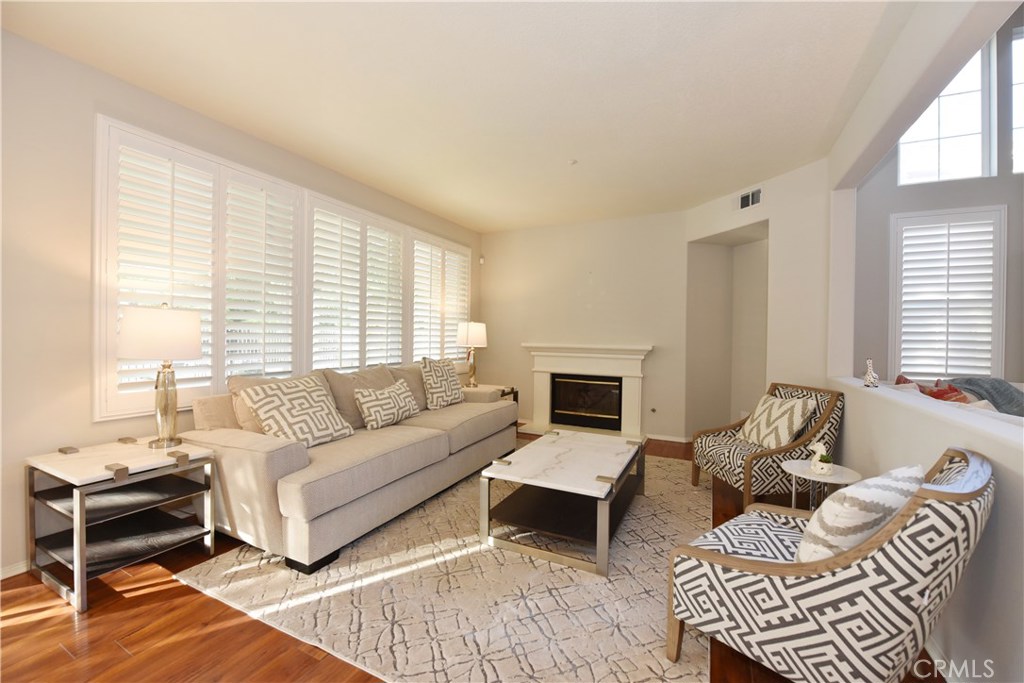 24 Silveroak Irvine, CA 92620 - Photo 15 of 64 a living room with furniture and a fireplace