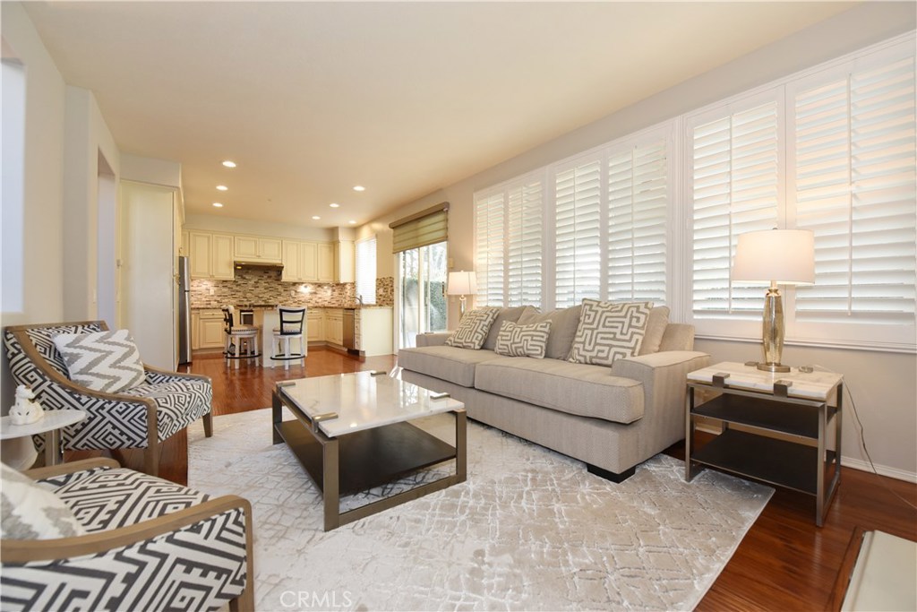 24 Silveroak Irvine, CA 92620 - Photo 19 of 64 a living room with furniture and a table
