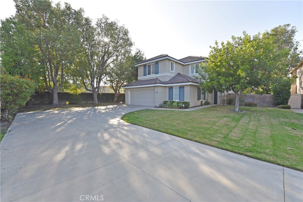 24 Silveroak Irvine, CA 92620 - Photo 2 of 64 a view of house with a big yard and large trees