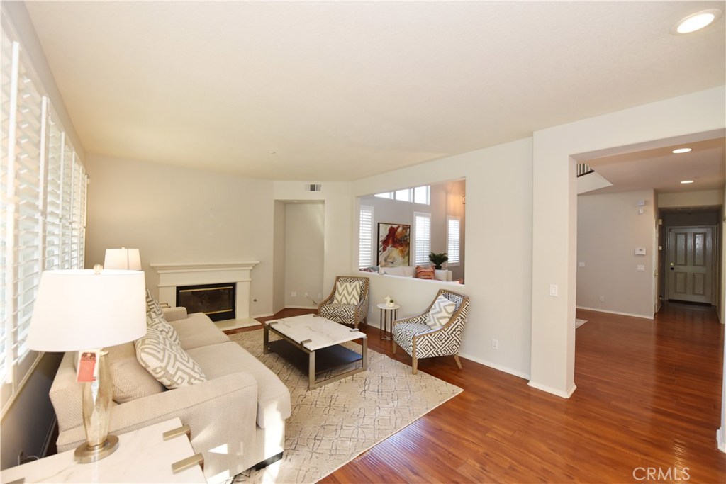 24 Silveroak Irvine, CA 92620 - Photo 23 of 64 a living room with furniture and a wooden floor