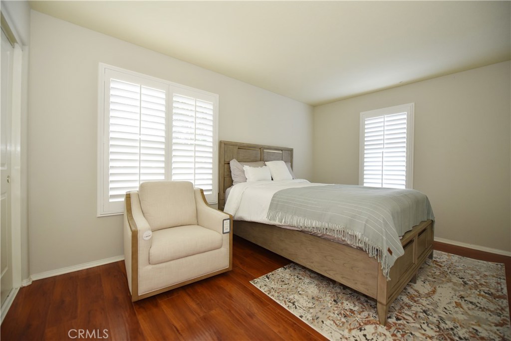 24 Silveroak Irvine, CA 92620 - Photo 25 of 64 a bedroom with a bed and a couch