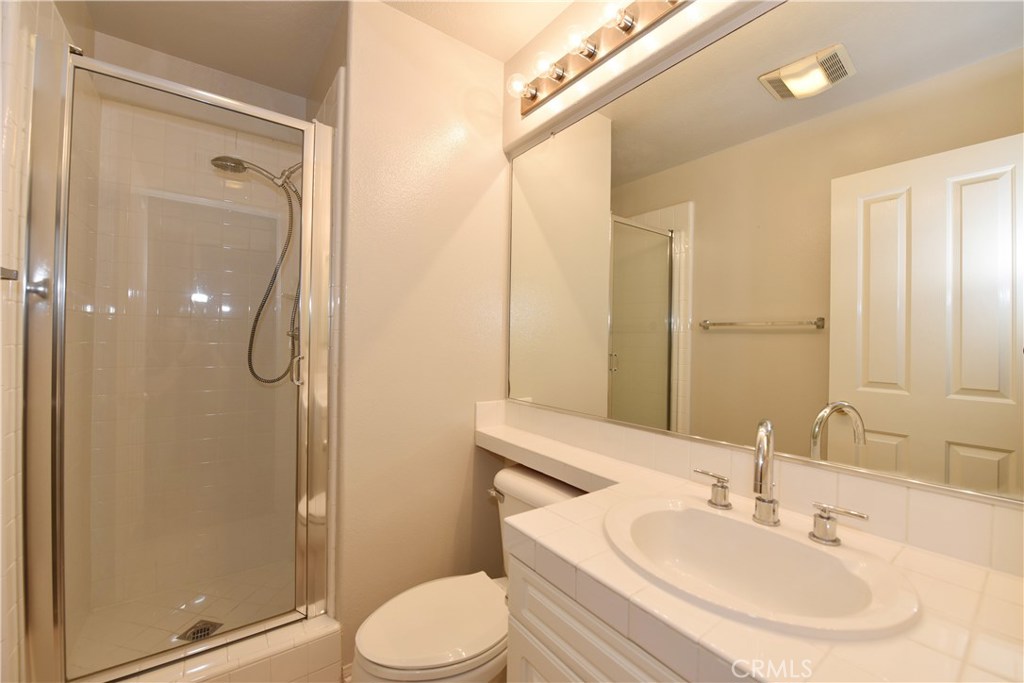 24 Silveroak Irvine, CA 92620 - Photo 28 of 64 a bathroom with a sink a toilet and shower