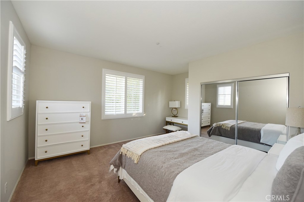 24 Silveroak Irvine, CA 92620 - Photo 30 of 64 a bedroom with a bed and a dresser