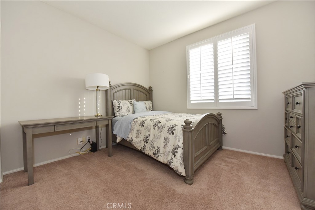 24 Silveroak Irvine, CA 92620 - Photo 33 of 64 a bedroom with a bed and a window