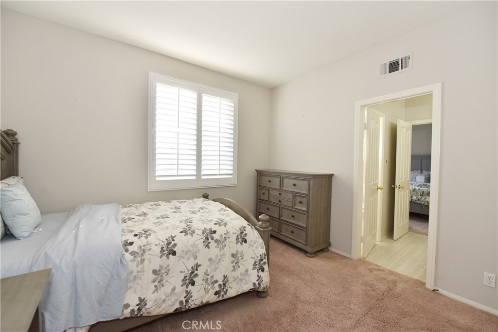 24 Silveroak Irvine, CA 92620 - Photo 34 of 64 a bedroom with a bed and a window