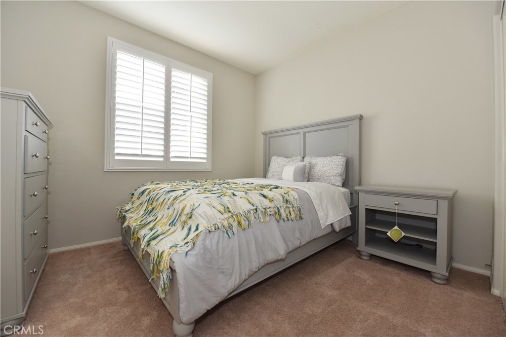 24 Silveroak Irvine, CA 92620 - Photo 36 of 64 a bed sitting in a bedroom next to a window
