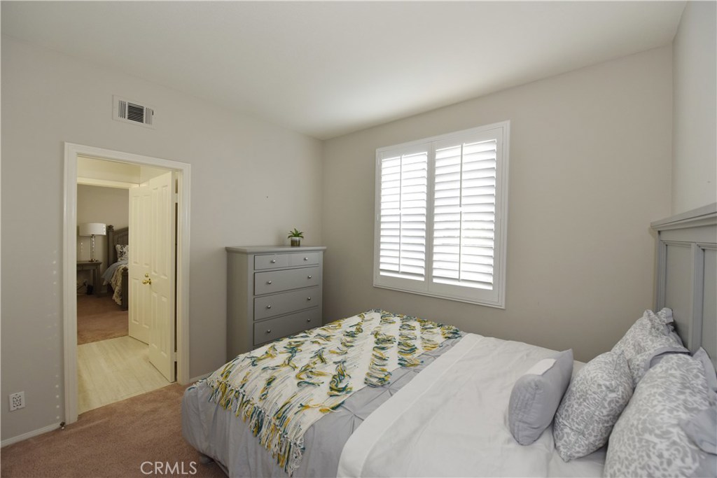 24 Silveroak Irvine, CA 92620 - Photo 37 of 64 a bedroom with a bed and a dresser