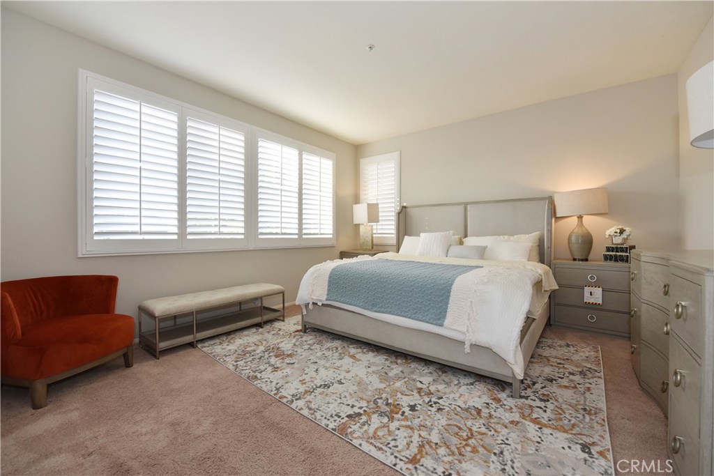 24 Silveroak Irvine, CA 92620 - Photo 39 of 64 a bedroom with a bed couch and window