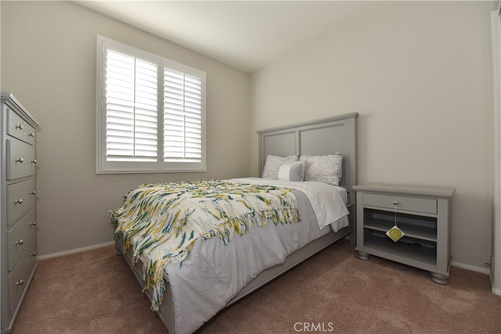 24 Silveroak Irvine, CA 92620 - Photo 50 of 64 a bed sitting in a bedroom next to a window