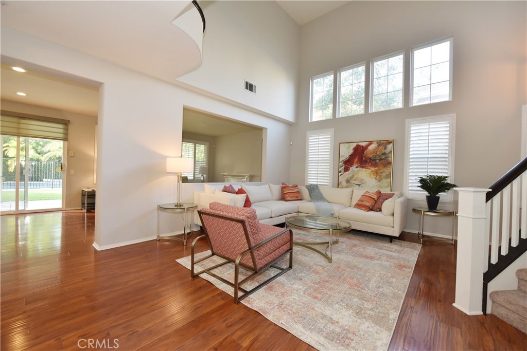 24 Silveroak Irvine, CA 92620 - Photo 6 of 64 a living room with furniture and a wooden floor