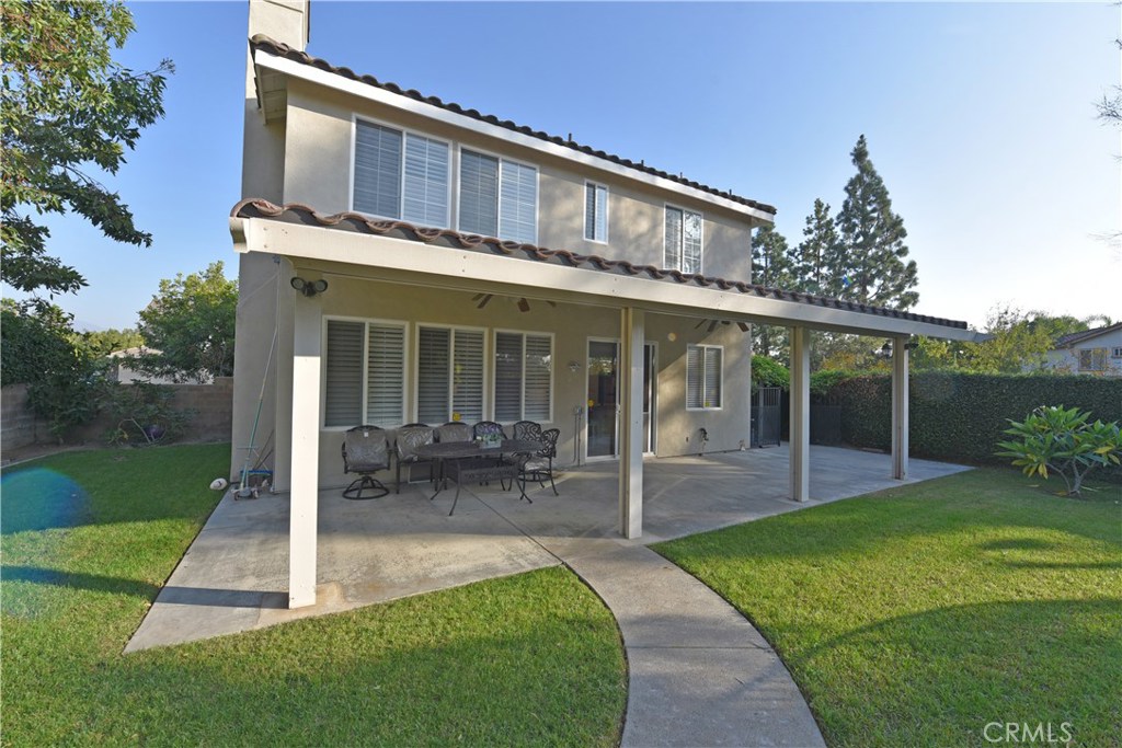 24 Silveroak Irvine, CA 92620 - Photo 62 of 64 a front view of a house with porch and garden
