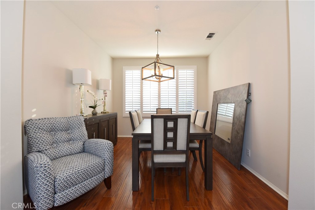 24 Silveroak Irvine, CA 92620 - Photo 9 of 64 a view of a dining room with furniture window and wooden floor