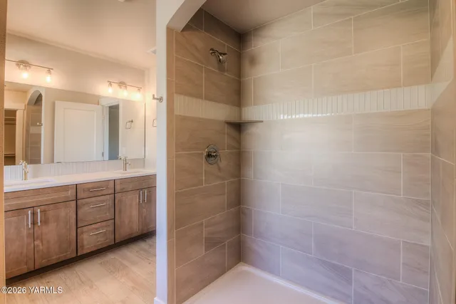 a bathroom with a shower and a sink