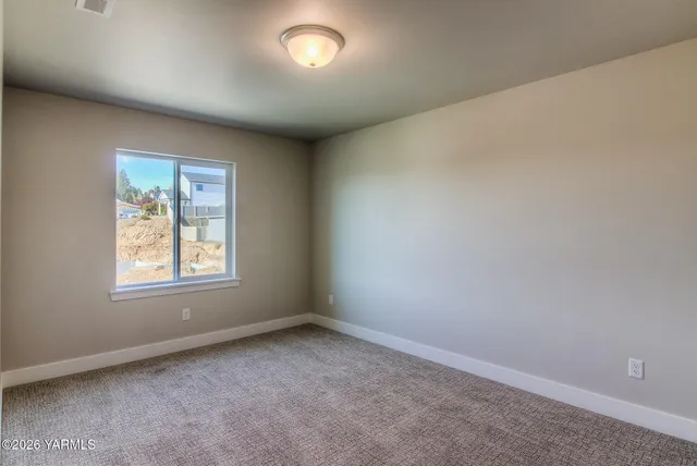 an empty room with windows and window