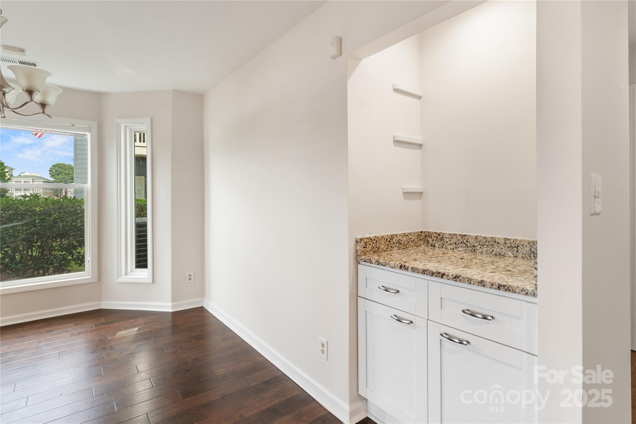 18647 Vineyard Point Lane Cornelius, NC 28031 - Photo 21 of 36 an empty room with wooden floor and window