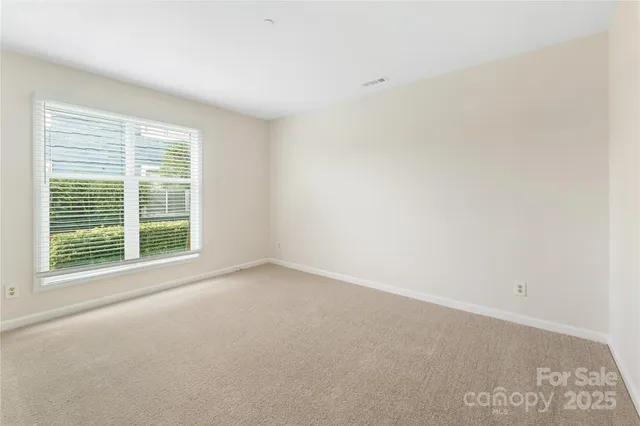 a view of a room that has a window in it