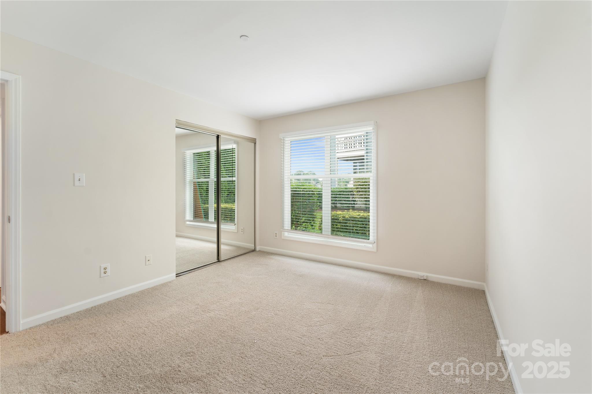 18647 Vineyard Point Lane Cornelius, NC 28031 - Photo 34 of 36 an empty room with windows