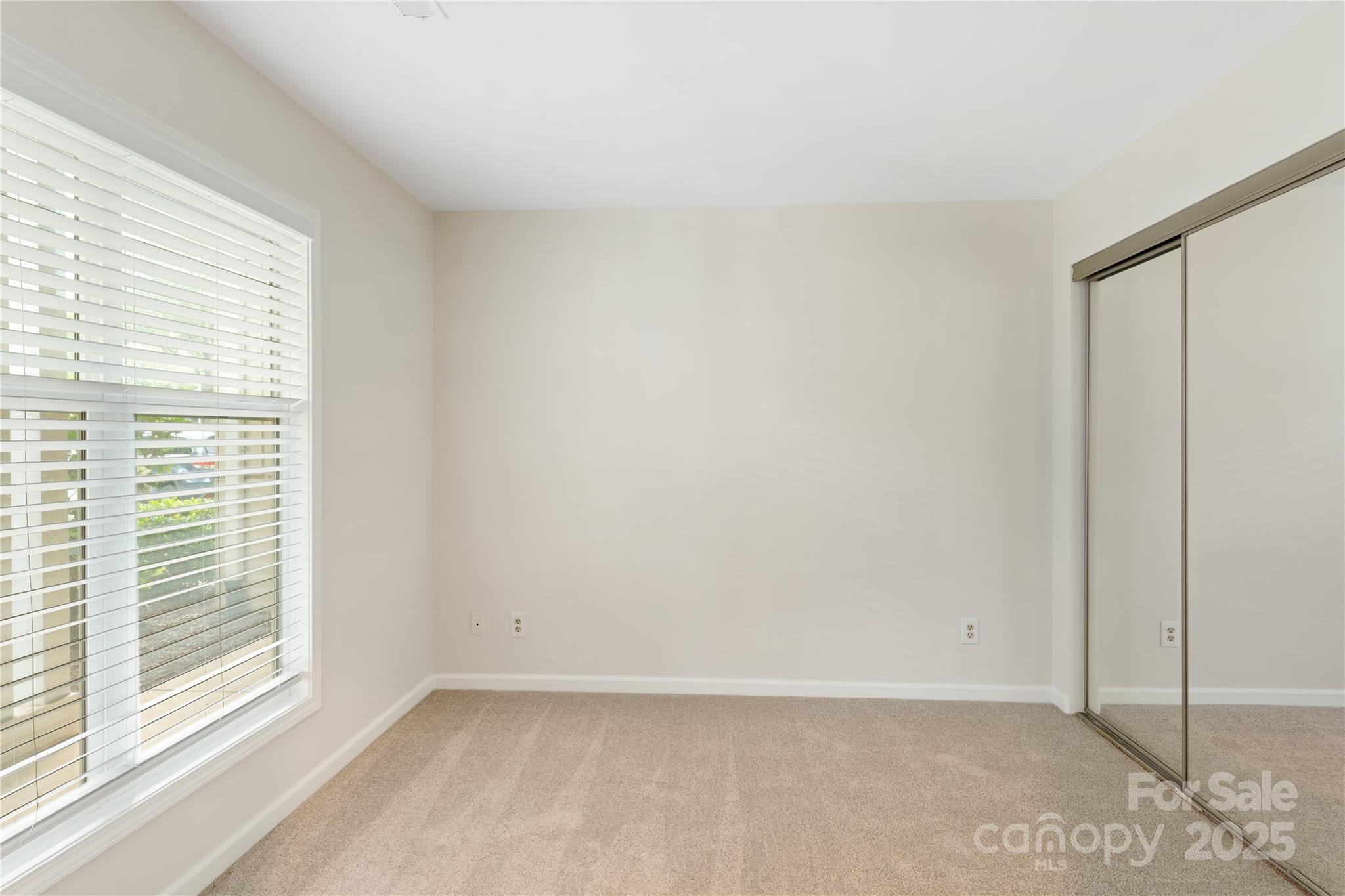 18647 Vineyard Point Lane Cornelius, NC 28031 - Photo 35 of 36 a view of an empty room with a window