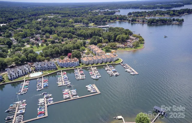 an aerial view of a house with a lake view