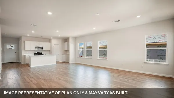 a kitchen with stainless steel appliances a sink a stove and microwave