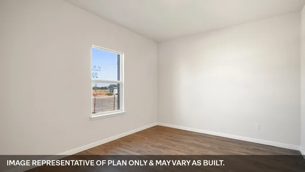 a view of kitchen with kitchen island white cabinets and wooden floor