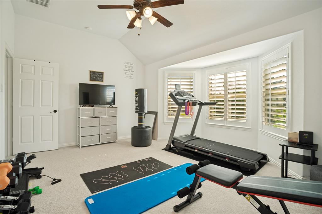 1461 Ramsbury Lane Prosper, TX 75078 - Photo 24 of 30 Spacious room featuring a vaulted ceiling and a ceiling fan with light fixture