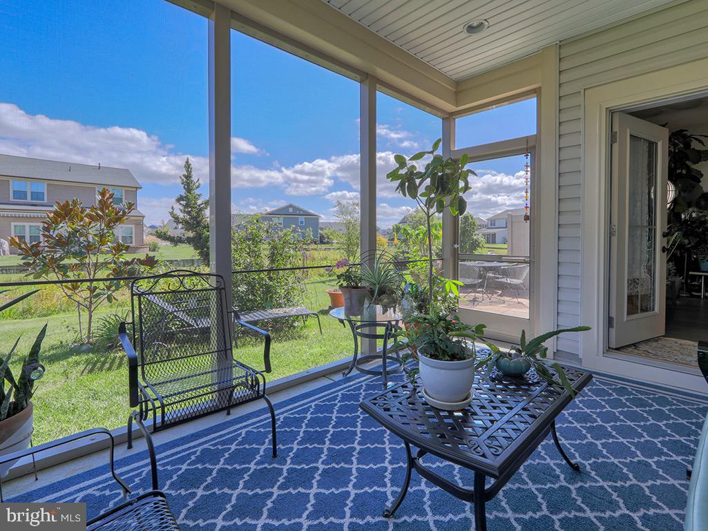 22375 Grebe Lane Ocean View, DE 19970 - Photo 5 of 60 Screened porch with views