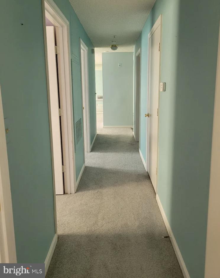 2806 Clear Shot Drive, Unit 3 Silver Spring, MD 20906 - Photo 17 of 20 a view of a hallway with wooden floor