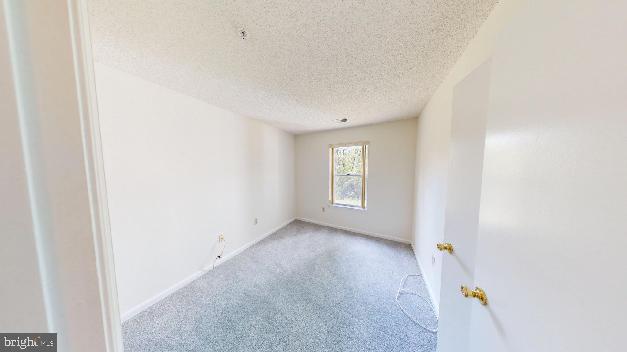 2806 Clear Shot Drive, Unit 3 Silver Spring, MD 20906 - Photo 8 of 20 a view of an empty room with a window