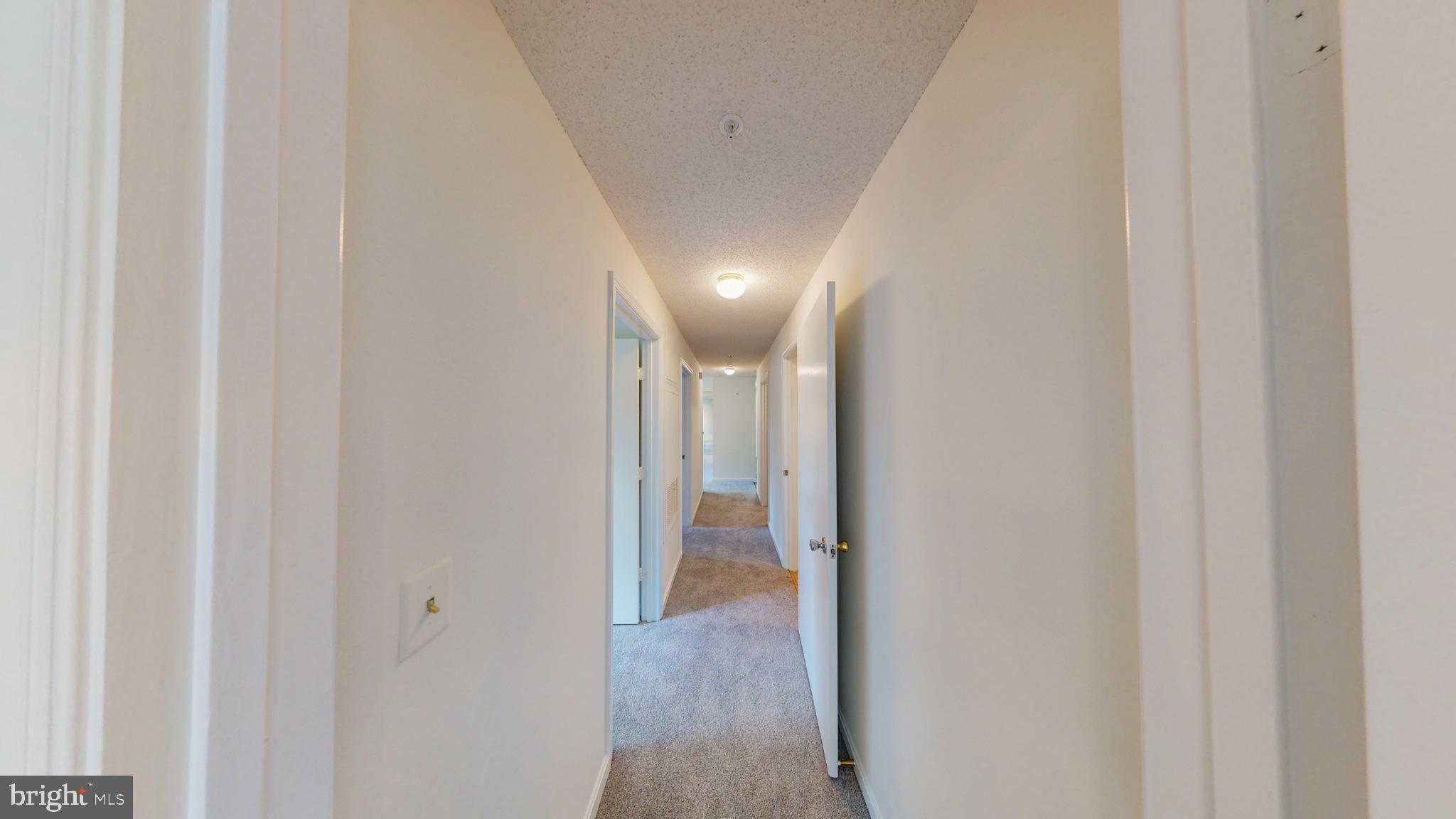 2806 Clear Shot Drive, Unit 3 Silver Spring, MD 20906 - Photo 9 of 20 a view of hallway with wooden floor