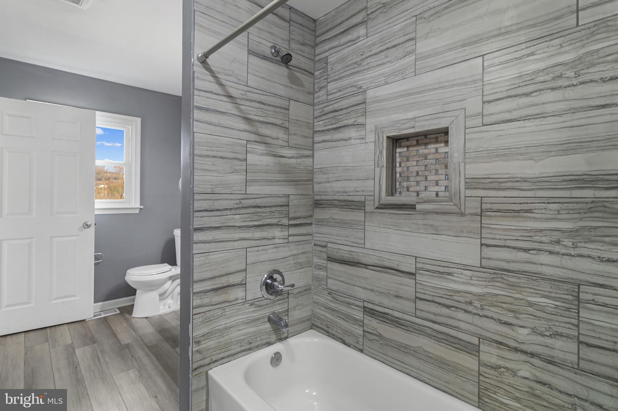 3218 Brethren Church Road Myersville, MD 21773 - Photo 11 of 30 a bathroom with a toilet and a shower