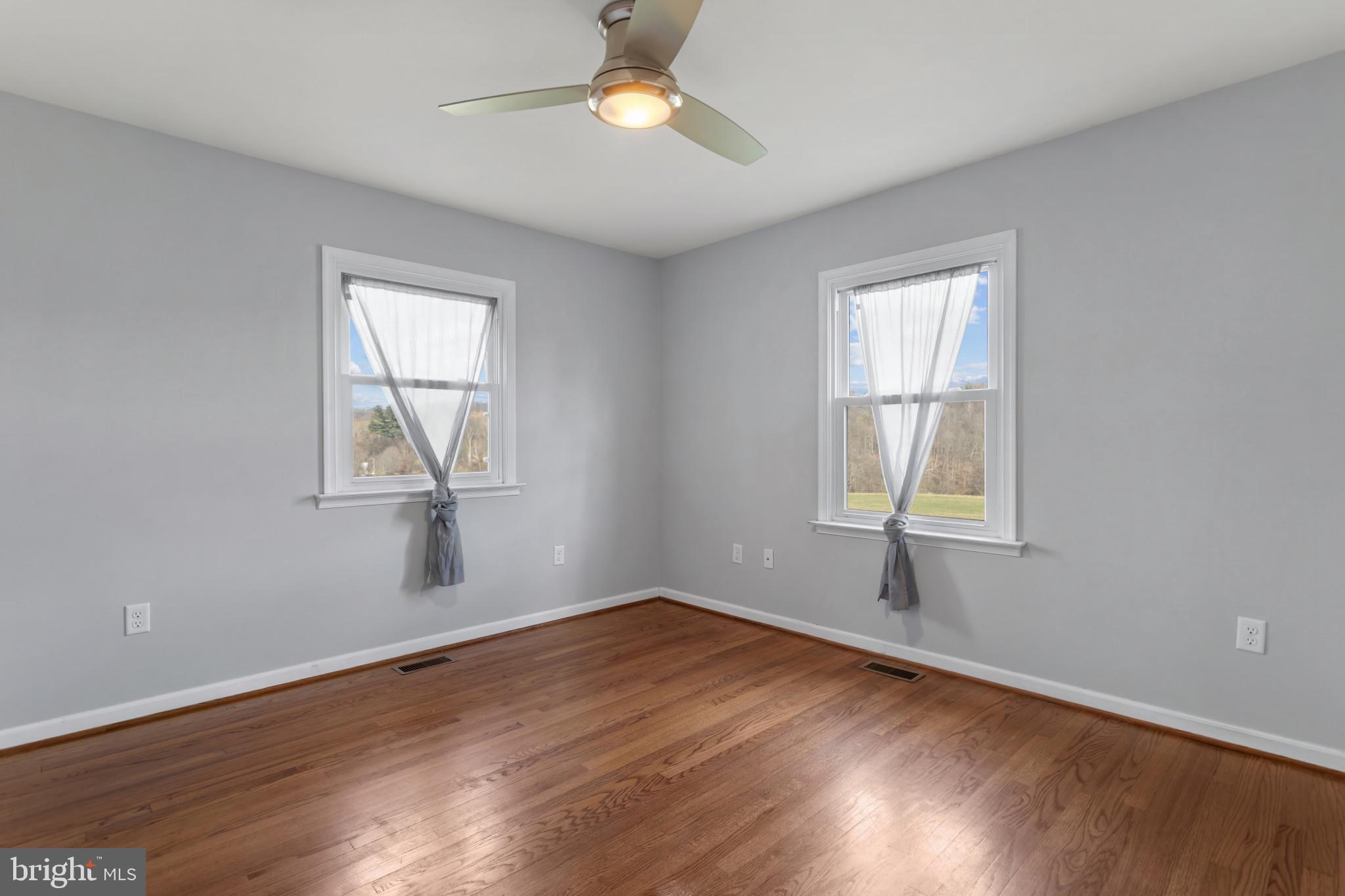 3218 Brethren Church Road Myersville, MD 21773 - Photo 14 of 30 wooden floor in an empty room with a window