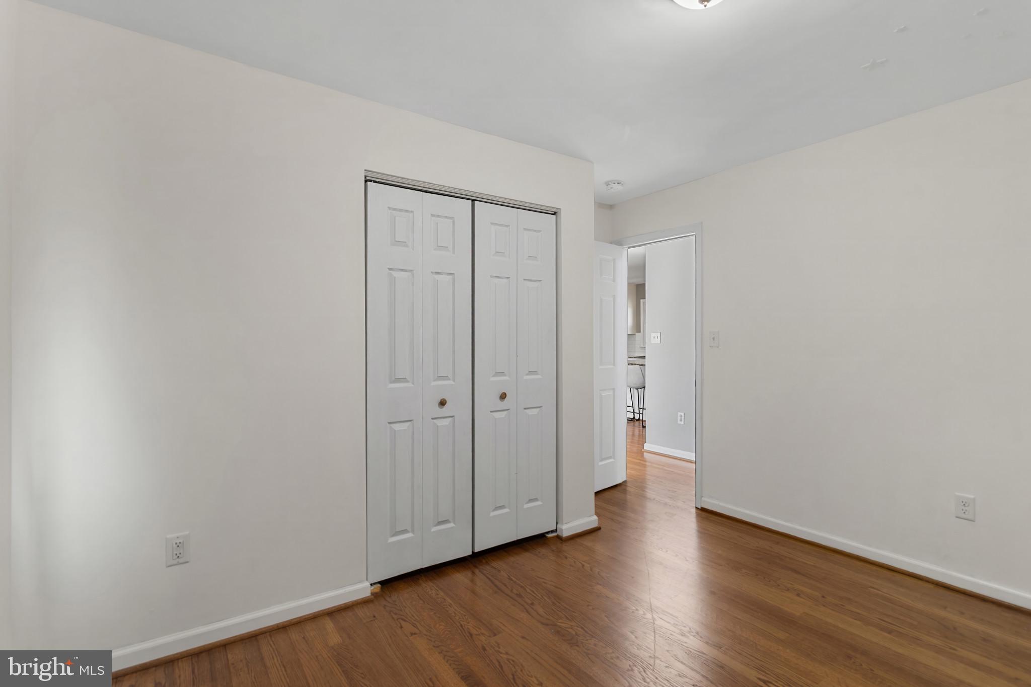 3218 Brethren Church Road Myersville, MD 21773 - Photo 16 of 30 a view of an empty room with wooden floor