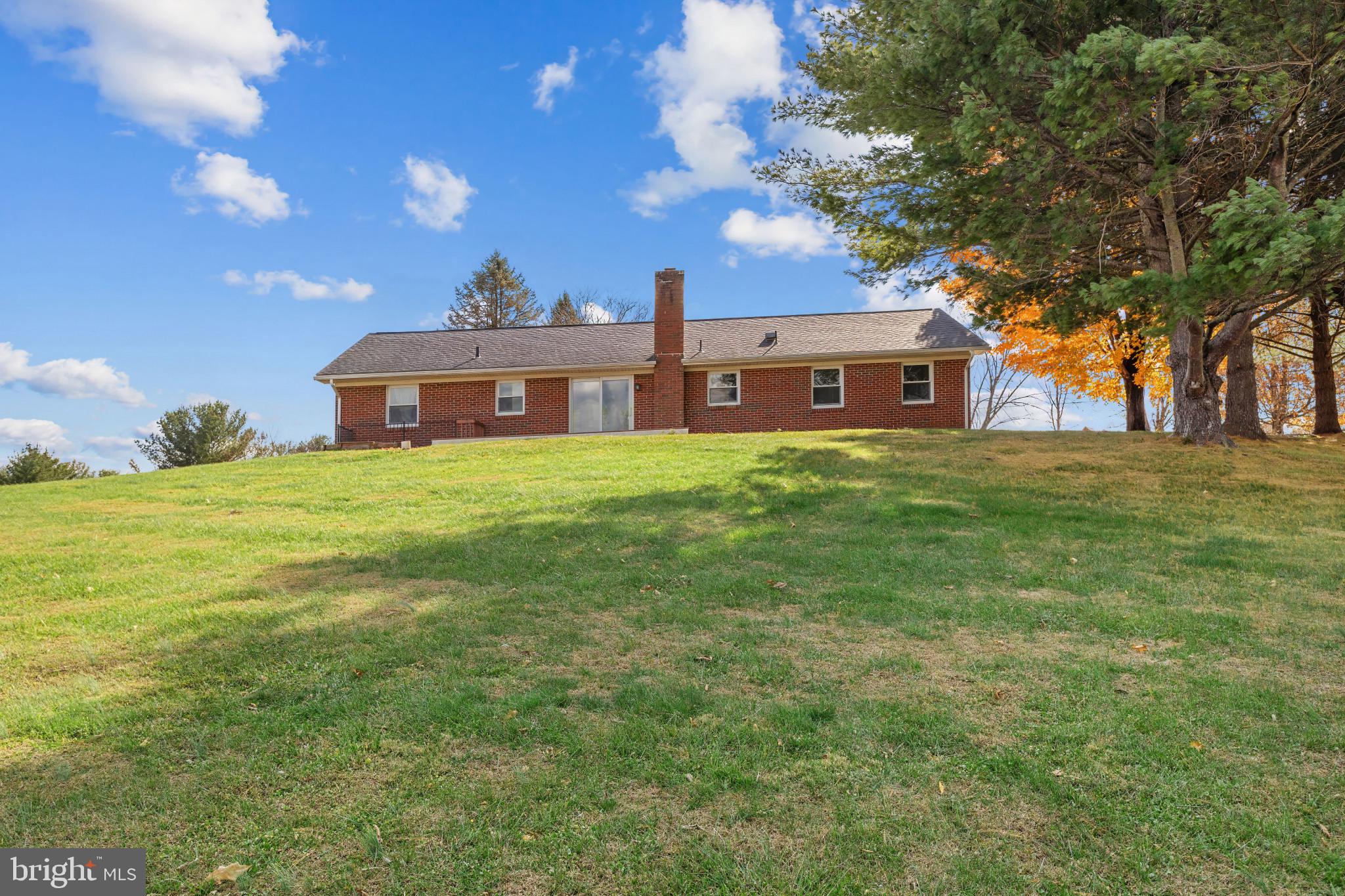 3218 Brethren Church Road Myersville, MD 21773 - Photo 30 of 30 a view of a house with a big yard and large tree