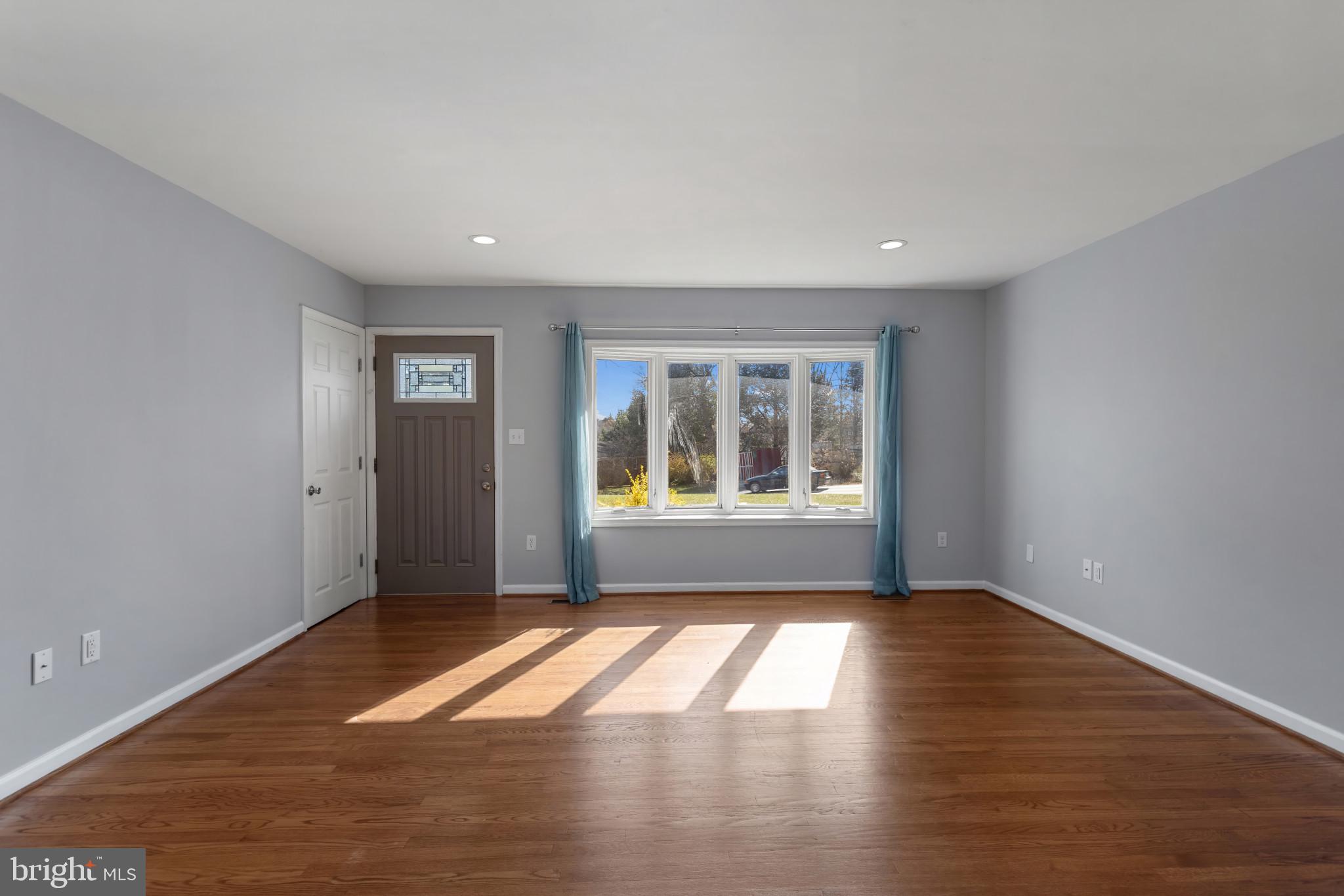 3218 Brethren Church Road Myersville, MD 21773 - Photo 6 of 30 a view of empty room with wooden floor and fan