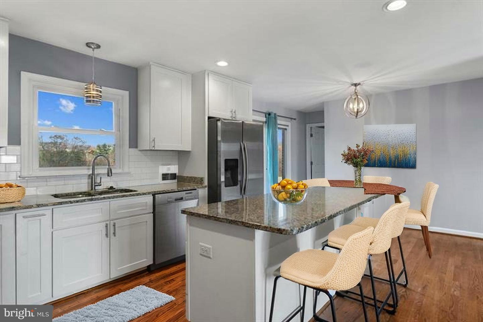 3218 Brethren Church Road Myersville, MD 21773 - Photo 9 of 30 a kitchen with granite countertop a sink stove and refrigerator
