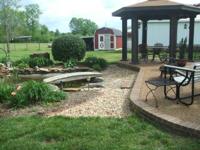 1867 Bethbirei Road Lewisburg, TN 37091 - Photo 19 of 20 FROM BACK OF THE PROPERTY LOOKING TOWARD THE HOUSE YOU SEE THE PATIO/GAZEBO AND STORAGE BUILDING