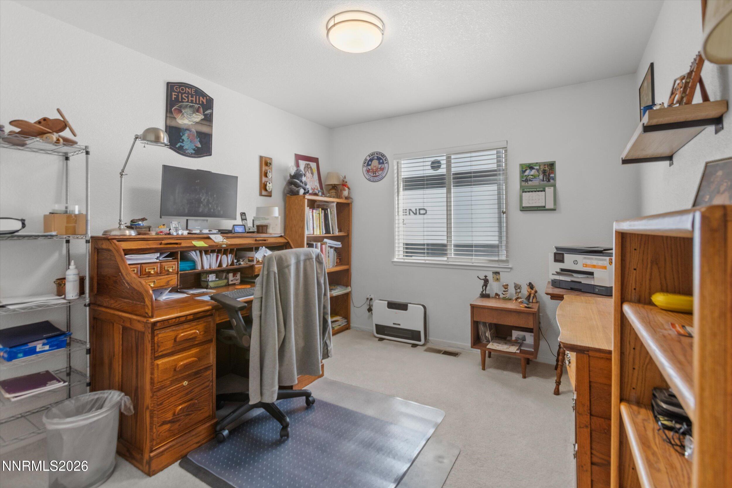 17533 Javalina Court Reno, NV 89508 - Photo 13 of 26 a view of a workspace with furniture and toys