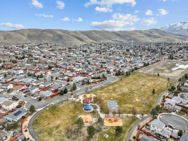 an aerial view of residential houses with outdoor space