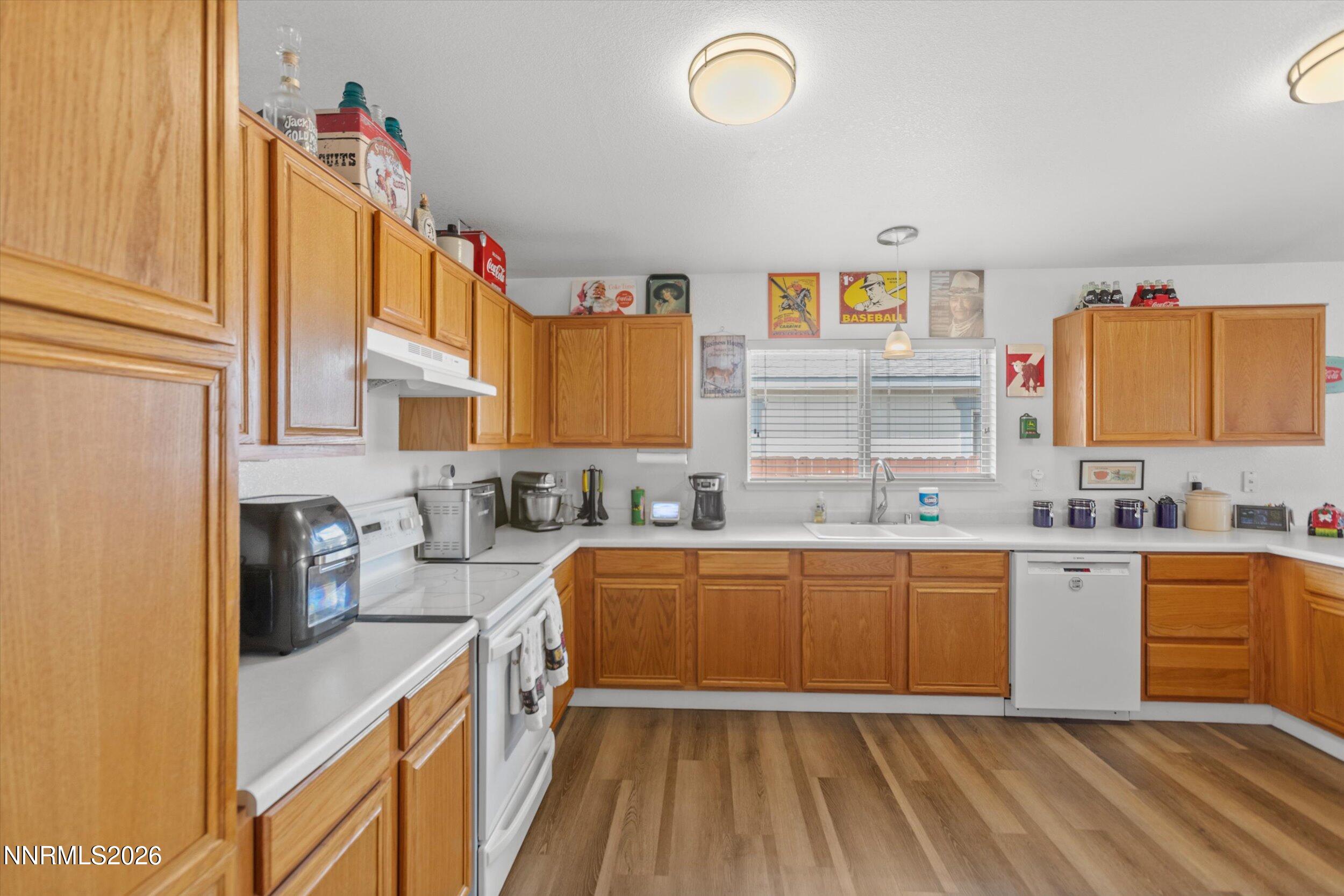 17533 Javalina Court Reno, NV 89508 - Photo 4 of 26 a kitchen with stainless steel appliances granite countertop a sink and cabinets