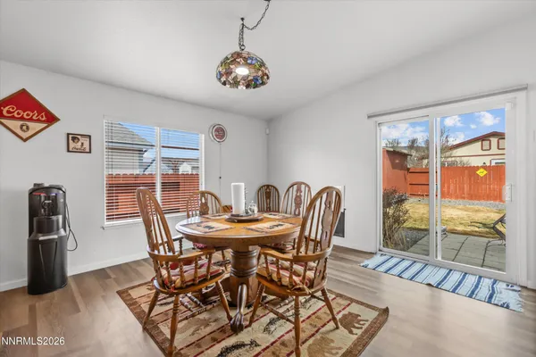 a view of a dining room with furniture window and outside view