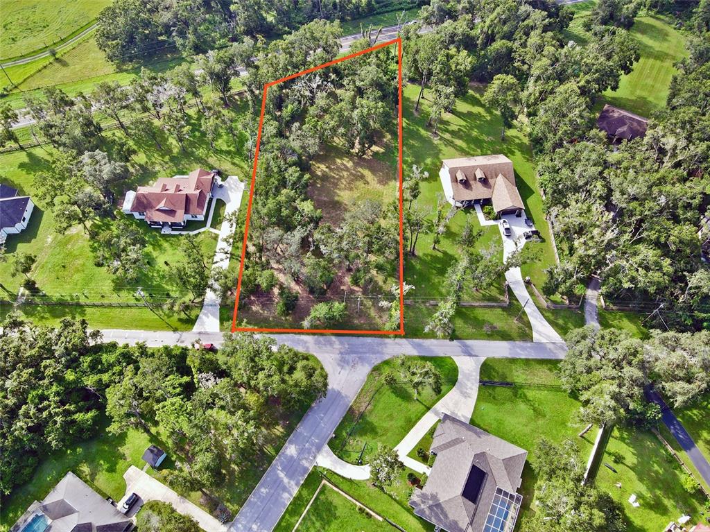 35174 Roth Lane Dade City, FL 33525 - Photo 3 of 22 an aerial view of residential house with outdoor space and swimming pool