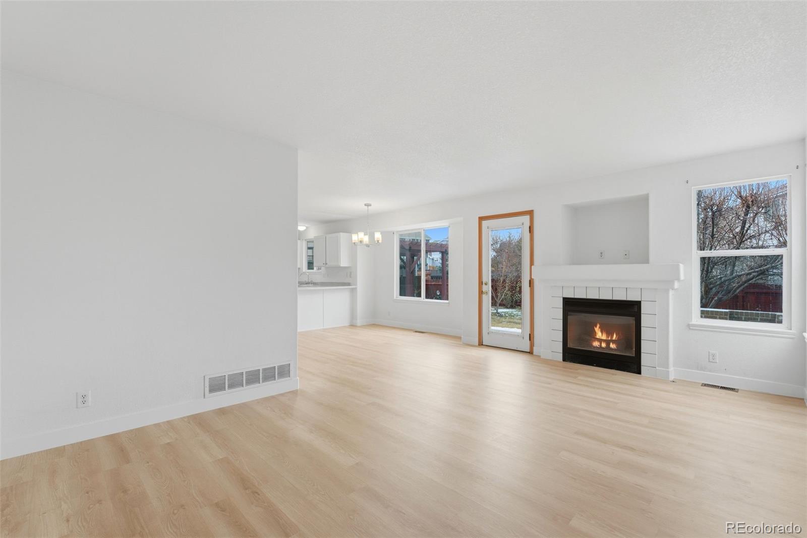 10505 Madison Way Northglenn, CO 80233 - Photo 11 of 49 a view of a livingroom with fireplace and window